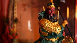 Buddhist traditional statues of chinese sacred gods on the altar inside the temple Stock Footage