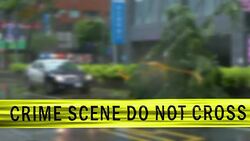 Boundary Tape and Defocused Squad Car at Crime Scene Stock Footage