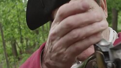 Revolutionary War soldier cocking musket Stock Footage