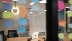 Staff in a late night team meeting Stock Footage