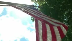 Ray of sunshine on American flag from Revolutionary War Stock Footage