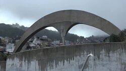 Commuters on rainy day in Rio during spread of Zika virus News Clip