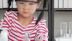 Education Topics:Funny little girl doing experiments in the laboratory.Science and education. Stock Footage