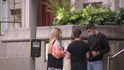 People wearing face mask on street of Manchester News Clip