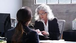 Senior professional woman meeting in office with young woman Stock Footage
