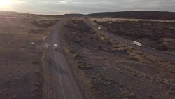 Aerial Drone Footage of Semi-Trucks Rolling Down the Highway Stock Footage