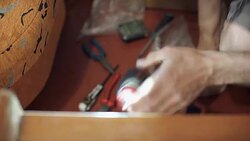 The man is repairing the home furniture Stock Footage