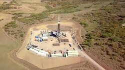 Aerial View of a Fracking Drilling Rig in the Autumn Mountains of Colorado Stock Footage