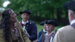 Man dressed as a Colonial offering a jug to Revolutionary War soldiers Stock Footage