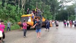 CLEAN : Malaysian villagers escape floods on excavator as 28,000 evacuated News Clip