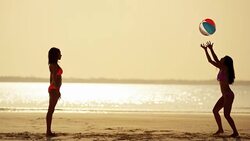 Luxury destination multi ethnic female on tropical beach Stock Footage