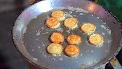 4K Close-up Shot Frying of Fish spawn on hot pan, Chinese Walking Street, Bangkok, Thailand Stock Footage