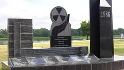 Monument to the outlying villages of the district. Granite memorial 'In memory of the resettled villages.' Memory of the accident at the Chernobyl nuclear power plant. Stock Footage