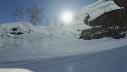 POV car driving in snow: icy road in Norway Stock Footage