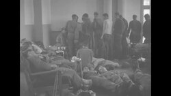 Exhausted and sleeping US soldiers waiting at airfield during the first days of the Korean War News Clip