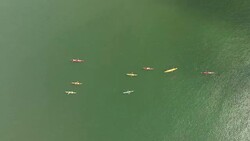 Group of people kayaking on Swedens west coast Stock Footage