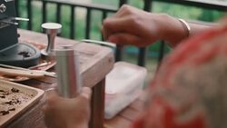 Young woman using coffee grinder at home. Stock Footage