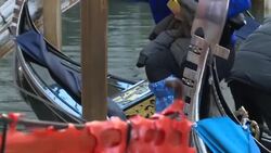 CLEAN : Tourists face the latest acqua alta in Venice News Clip