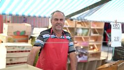 Salesman at farmer's market Stock Footage
