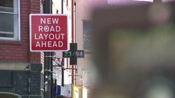 Traffic and pedestrians on streets in Bristol News Clip