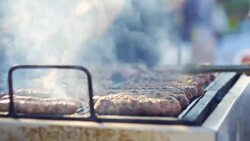 Cooking Kebabce. Balkan meatball barbeque on grill at local traditional festival Stock Footage