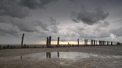 Storm clouds moving in over the Wadden sandflats in the Dutch Waddensea region in the North of The Netherlands. Stock Footage