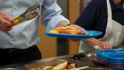 Starmer entertains children after serving them school meals News Clip