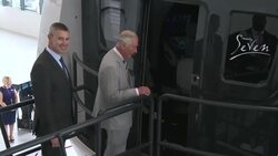 Prince Charles is shown a flight simulator machine News Clip