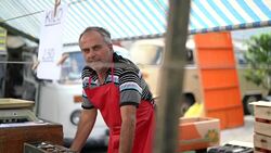 Salesman at farmer's market Stock Footage