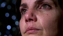 close up on lonely divorced woman alone cries in the darkness at Christmas Stock Footage
