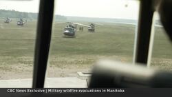 Military evacuation flight out of the wildfire zone News Clip