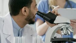 Black Male Scientist Using Microscope Stock Footage