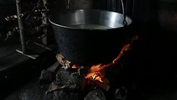 Steaming old-fashion pot over fire Stock Footage