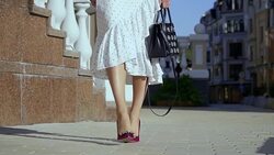 Beautiful female legs on a city street Stock Footage