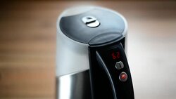 Boiling water in an electric cordless kettle with a digital display with red numbers. Stock Footage