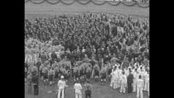 Harvard alumni engage in confetti fight with other alumni and people in stands at the Harvard Bowl in Cambridge, MA News Clip