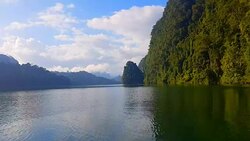 view of landscape limestone mountain rang and green forest with water lake Stock Footage