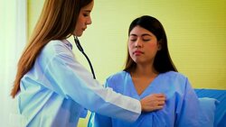 Young Asian female doctor and woman patient lying in bed while discussing and consultation medical examination at hospital room , Healthcare and medical concept, Doctor and patient Stock Footage