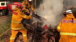 Australia firefighters try to dampen down flames Instructional Video