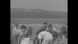 Boys, some in Scout uniforms, play football, 1930s News Clip