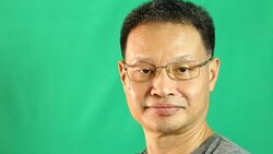 Thai man with green background Stock Footage