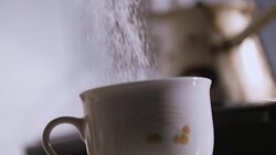 Adding sugar in a cup for a coffee Stock Footage