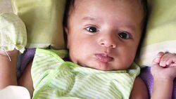 Newborn baby playing Stock Footage