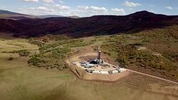Aerial View of a Fracking Drilling Rig in the Autumn Mountains of Colorado Stock Footage