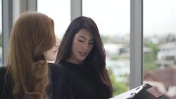 business woman and partner analyzing and planning strategy business. Worker sitting and thinking a new ideas to success Stock Footage