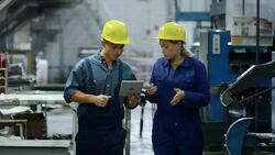 Engineers Using Tablet Computer and Talking Stock Footage