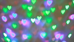 Blinking colorful garlands bokeh in the shape of heart used as background for Valentines Day Stock Footage