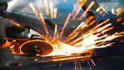 Sparks from welding car parts in a car repair shop Stock Footage