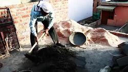 Worker mixing cement on construction site. Stock Footage