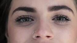Close-up of pretty macro eyes of teen girl opening eyes Stock Footage